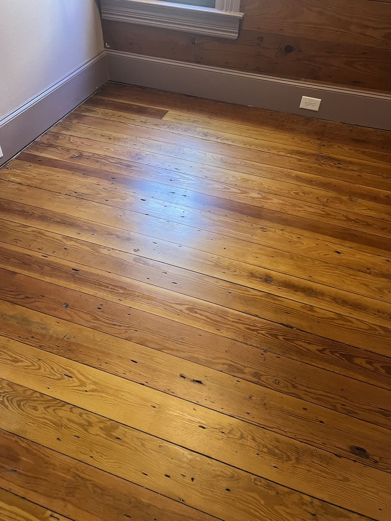Repaired and refinished heart pine floor